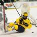 Michigan senior center Kevin Lynch searches for the puck in the second period of the game against Michigan State on Friday. Daniel Brenner I AnnArbor.com